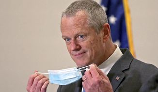 In this April 6, 2021, file photo, Massachusetts Gov. Charlie Baker speaks to reporters after receiving a Pfizer COVID-19 vaccine at the Hynes Convention Center in Boston. Gov. Baker is facing increasing criticism of his handling of the COVID-19 outbreak at the Holyoke Soldiers&#39; Home, with calls mounting for a legislative response to the deaths, which claimed the lives of 76 veteran residents last spring. (Matt Stone/Boston Herald via AP, Pool, File)