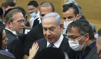 Israeli Prime Minister Benjamin Netanyahu looks on after a special session of the Knesset whereby Israeli lawmakers elected a new president, at the Knesset, Israel&#39;s parliament, in Jerusalem Wednesday,  June 2, 2021. (Ronen Zvulun/Pool Photo via AP)