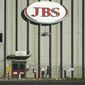 In this Oct. 12, 2020, file photo, a worker heads into the JBS meatpacking plant in Greeley, Colo.  A weekend ransomware attack on the world’s largest meat company is disrupting production around the world just weeks after a similar incident shut down a U.S. oil pipeline. The White House confirms that Brazil-based meat processor JBS SA notified the U.S. government Sunday, May 30, 2021, of a ransom demand from a criminal organization likely based in Russia.  (AP Photo/David Zalubowski, File)