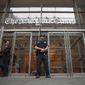 A police officer stands outside The New York Times building in New York, June 28, 2018. Trump Justice Department secretly obtained the phone records of four New York Times journalists as part of a leak investigation, the newspaper said Wednesday, June 2, 2021. (AP Photo/Mary Altaffer) ** FILE **