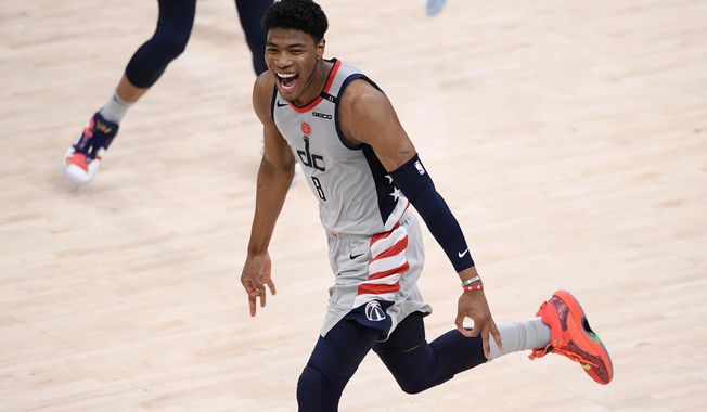 Washington Wizards forward Rui Hachimura (8) reacts after he made a three-point basket during the second half of Game 4 in a first-round NBA basketball playoff series against the Philadelphia 76ers, Monday, May 31, 2021, in Washington. (AP Photo/Nick Wass)