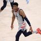 Washington Wizards forward Rui Hachimura (8) reacts after he made a three-point basket during the second half of Game 4 in a first-round NBA basketball playoff series against the Philadelphia 76ers, Monday, May 31, 2021, in Washington. (AP Photo/Nick Wass)