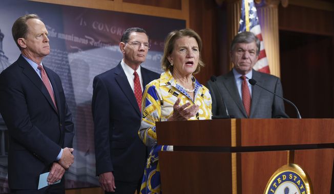 In this photo taken Thursday, May 27, 2021, Sen. Shelley Moore Capito, R-W.Va., the GOP&#x27;s lead negotiator on a counteroffer to President Joe Biden&#x27;s infrastructure plan, speaks at a news conference as she is joined by, from left, Sen. Pat Toomey, R-Pa., Sen. John Barrasso, R-Wyo., chairman of the Senate Republican Conference, and Sen. Roy Blunt, R-Mo., at the Capitol in Washington. (AP Photo/J. Scott Applewhite) ** FILE **