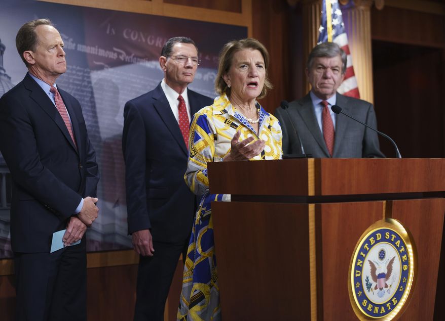 In this photo taken Thursday, May 27, 2021, Sen. Shelley Moore Capito, R-W.Va., the GOP's lead negotiator on a counteroffer to President Joe Biden's infrastructure plan, speaks at a news conference as she is joined by, from left, Sen. Pat Toomey, R-Pa., Sen. John Barrasso, R-Wyo., chairman of the Senate Republican Conference, and Sen. Roy Blunt, R-Mo., at the Capitol in Washington. (AP Photo/J. Scott Applewhite) ** FILE **