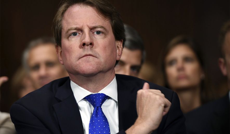 In this Sept. 27, 2018, file photo, then-White House counsel Don McGahn listens as Supreme Court nominee Brett Kavanaugh testifies before the Senate Judiciary Committee on Capitol Hill in Washington. After years of trying, the House Judiciary Committee is set to question McGahn on June 4, 2021, two years after House Democrats originally sought his testimony as part of investigations into former President Donald Trump. (Saul Loeb/Pool Photo via AP, File)
