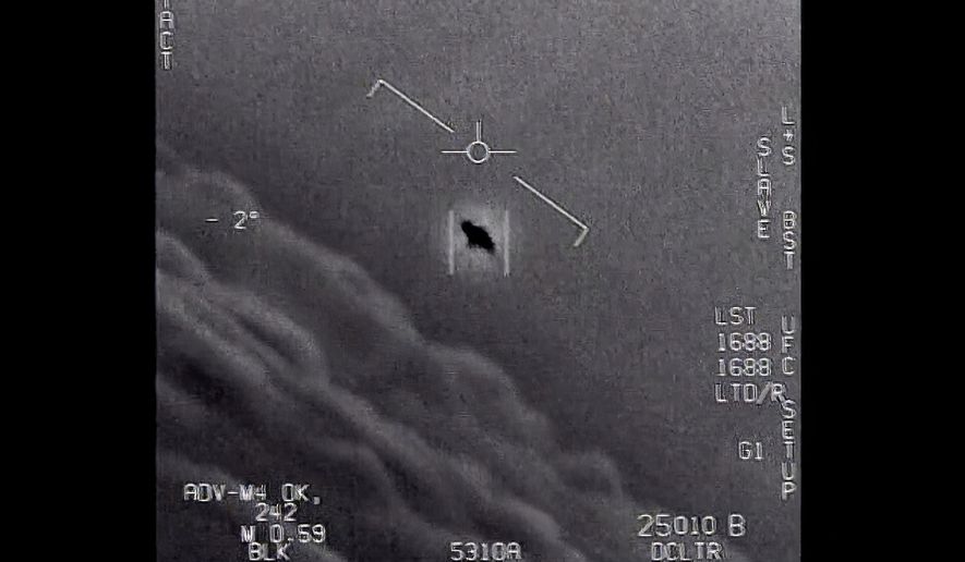 In this image from video provided by the Department of Defense labeled Gimbal, from 2015, an unexplained object is seen at the center as it is tracked as it soars high along the clouds, traveling against the wind. (Department of Defense via AP) **FILE**