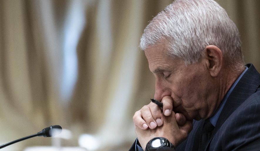 Dr. Anthony Fauci, director of the National Institute of Allergy and Infectious Diseases, listens during a Senate Appropriations Subcommittee looking into the budget estimates for National Institute of Health (NIH) and the state of medical research, Wednesday, May 26, 2021, on Capitol Hill in Washington. (Sarah Silbiger/Pool via AP)