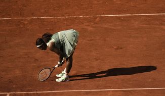 United States Serena Williams reacts after missing a shot as she plays against Kazakhstan&#39;s Elena Rybakina during their fourth round match on day 8, of the French Open tennis tournament at Roland Garros in Paris, France, Sunday, June 6, 2021. (AP Photo/Thibault Camus)