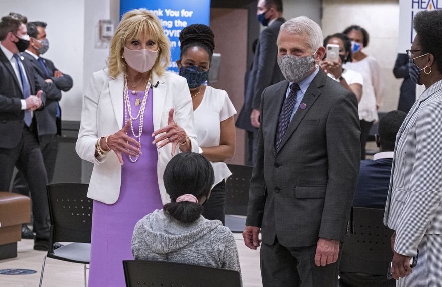 First lady Jill Biden, center left, and Dr. Anthony Fauci, director of the National Institute of Allergy and Infectious Diseases, speak to a person as they visit a vaccine clinic at the Abyssinian Baptist Church in the Harlem neighborhood of New York Sunday, June 6, 2021. (AP Photo/Craig Ruttle)