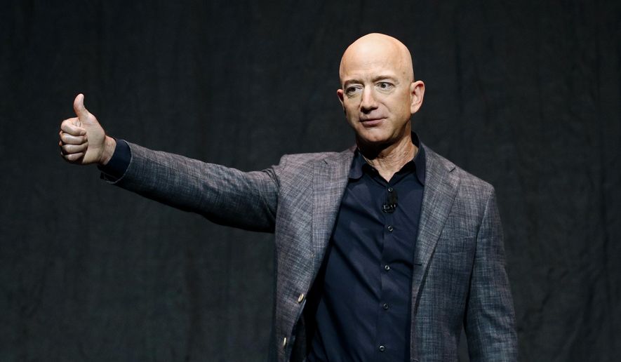 Jeff Bezos speaks at an event before unveiling Blue Origin&#39;s Blue Moon lunar lander in Washington, in this Thursday, May 9, 2019, file photo. Amazon&#39;s Jeff Bezos will be among the people on Blue Origin&#39;s first human space flight next month.The company said in a post Monday, June 7, 2021, that Bezos will be joined on the flight by his brother Mark and the winner of an online auction.(AP Photo/Patrick Semansky, File) **FILE**