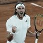 Stefanos Tsitsipas of Greece celebrates after defeating Russia&#x27;s Daniil Medvedev during their quarterfinal match of the French Open tennis tournament at the Roland Garros stadium Tuesday, June 8, 2021 in Paris. (AP Photo/Thibault Camus)