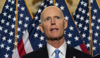 Sen. Rick Scott, R-Fla., speaks with reporters after a Republican caucus luncheon on Capitol Hill, Tuesday, June 8, 2021, in Washington. (AP Photo/Alex Brandon) ** FILE **