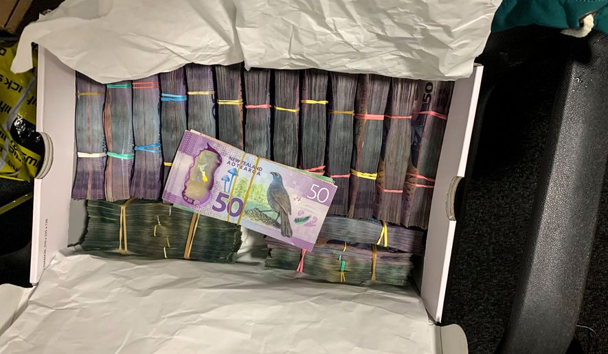 In this undated photo supplied by the New Zealand police, a box containing a large amounts of cash is seen after being discovered during a police raid as part of Operation Trojan. Authorities in Australia and New Zealand Tuesday, June 8, 2021, say they have dealt a huge blow against organized crime after hundreds of criminals were tricked into using a messaging app that was being secretly run by the FBI. (New Zealand Police via AP)
