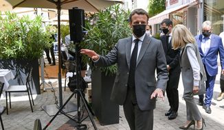 French President Emmanuel Macron arrives for a lunch Tuesday June 8, 2021 in Valence, southeastern France. French President Emmanuel Macron has been slapped in the face by a man during a visit in a small town of southeastern France, Macron&#39;s office confirmed. (Philippe Desmazes, Pool via AP)
