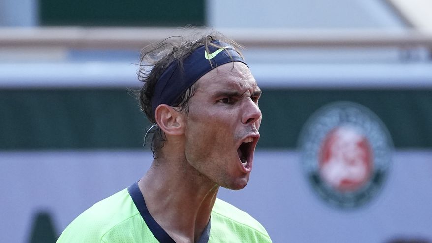 Spain&#39;s Rafael Nadal shouts as he plays Argentina&#39;s Diego Schwartzman during their quarterfinal match of the French Open tennis tournament at the Roland Garros stadium Wednesday, June 9, 2021 in Paris. (AP Photo/Michel Euler)