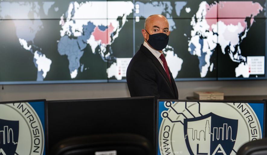 Secretary of Homeland Security Alejandro Mayorkas tours the City of Los Angeles Information Technology Agency (ITA) command center, responsible for the city&#39;s cybersecurity at the Emergency Operations Center in Los Angeles Thursday, June 10, 2021. (AP Photo/Damian Dovarganes)