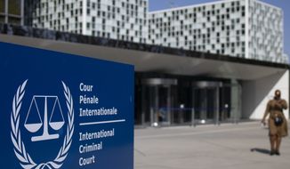 This Wednesday, March 31, 2021, file photo shows the exterior view of the International Criminal Court in The Hague, Netherlands. A group of lawyers presented a dossier of evidence to prosecutors at the International Criminal Court on Thursday June 10, 2021, that they say establishes jurisdiction for the global tribunal to investigate allegations Chinese authorities are involved in grave crimes targeting Uyghurs, a largely Muslim ethnic group. (AP Photo/Peter Dejong, File)