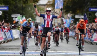 This Sept. 27, 2019, file photo shows United States&#39; Megan Jastrab celebrating winning the women junior event at the road cycling World Championships in Harrogate, England. The cycling team that the U.S. is taking to the Tokyo Olympics is a little bit different than the one it would have taken a year ago, when the COVID-19 pandemic forced organizers to postpone the Summer Games by an entire year. Among those on the team announced Thursday, June 10, 2021, are mountain biker Haley Batten, who&#39;s been on the podium each of the first two World Cup races of the season; Jastrab, the 19-year-old track cycling prodigy who will be part of the gold medal-favorite women&#39;s pursuit team and also contest the Madison; and 23-year-old time trial star Brandon McNulty. (AP Photo/Manu Fernandez, File) **FILE**