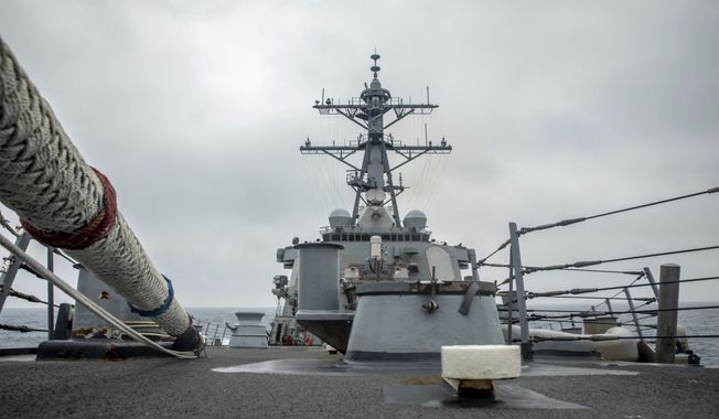 In this photo released by the U.S. Navy, the U.S. Arleigh Burke-class guided-missile destroyer USS Curtis Wilbur (DDG 54) conducts routine operations in the Taiwan Strait, May 18, 2021. China on Thursday, May 20, 2021, issued its second protest in as many days over United States naval activity in the region, drawing an unusually sharp response from the U.S. 7th Fleet, which accused Beijing of attempting to assert illegitimate maritime rights at the expense of its neighbors. (Mass Communication Specialist 3rd Class Zenaida Roth, U.S. Navy via AP) **FILE**
