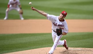 Washington Nationals starting pitcher Erick Fedde delivers a pitch during the fourth inning of the first baseball game of a doubleheader against the San Francisco Giants, Saturday, June 12, 2021, in Washington. This game is a makeup of a postponed game from Thursday. (AP Photo/Nick Wass)