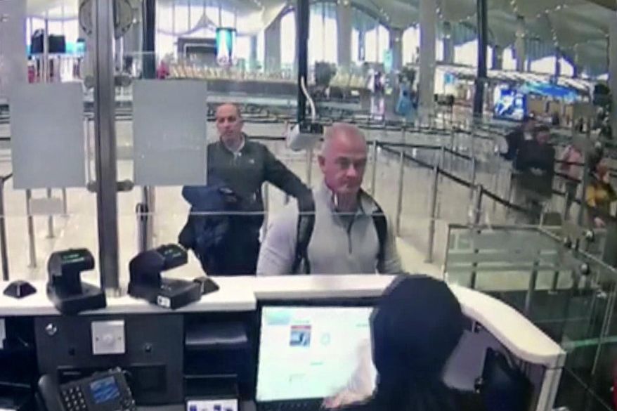This Dec. 30, 2019, image from security camera video shows Michael L. Taylor, center, and George-Antoine Zayek at passport control at Istanbul Airport in Turkey. Americans Michael Taylor and his son Peter Taylor go on trial in Tokyo on Monday, June 14, 2021, on suspicion they helped Nissan former Chairman Carlos Ghosn skip bail in Japan and escape to Lebanon in December 2019. (DHA via AP, File)