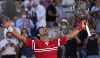 Serbia&#39;s Novak Djokovic celebrates after defeating Stefanos Tsitsipas of Greece in their final match of the French Open tennis tournament at the Roland Garros stadium Sunday, June 13, 2021 in Paris. (AP Photo/Michel Euler)