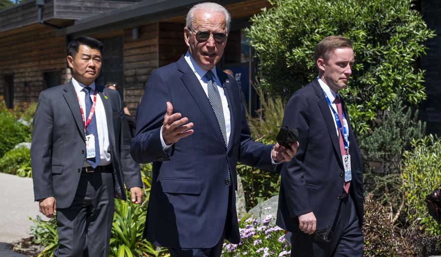 President Joe Biden walks with national security adviser Jake Sullivan, right, and members of the Secret Service as he arrives for the final session of the G-7 summit in Carbis Bay, England, Sunday, June 13, 2021. (Doug Mills/The New York Times via AP, Pool)