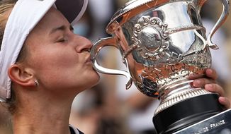 Czech Republic&#39;s Barbora Krejcikova kisses the cup after defeating Russia&#39;s Anastasia Pavlyuchenkova during their final match of the French Open tennis tournament at the Roland Garros stadium Saturday, June 12, 2021 in Paris. (AP Photo/Michel Euler) **FILE***