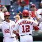 Washington Nationals&#39; Kyle Schwarber celebrates his home run with Trea Turner (7) and Juan Soto (22) during the first inning of a baseball game against the San Francisco Giants, Sunday, June 13, 2021, in Washington. (AP Photo/Nick Wass)