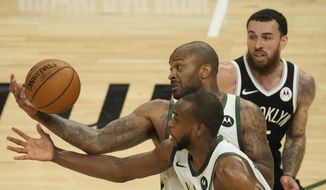 Milwaukee Bucks&#39; P.J. Tucker and Khris Middleton steal the ball from Brooklyn Nets&#39; Mike James during the first half of Game 4 of the NBA Eastern Conference basketball semifinals game Sunday, June 13, 2021, in Milwaukee. (AP Photo/Morry Gash)