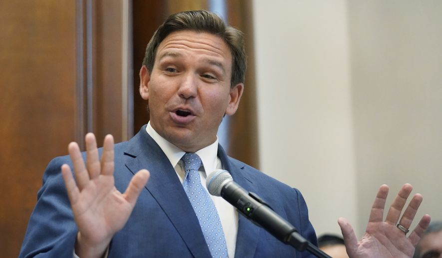 Florida Gov. Ron DeSantis gestures as he speaks, Monday, June 14, 2021, at the Shul of Bal Harbour, a Jewish community center in Surfside, Fla. DeSantis visited the South Florida temple to denounce antisemitism and stand with Israel, while signing a bill into law that would require public schools in his state to set aside moments of silence for children to meditate or pray. (AP Photo/Wilfredo Lee)