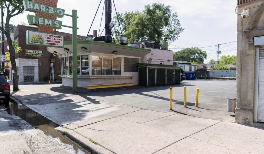 This photo shows the scene of a multiple shooting, Saturday, June 12, 2021 in Chicago. Chicago Police are searching for two men who opened fire on a group of people on the city's South Side early Saturday, killing one woman and injuring nine people. (Anthony Vazquez/Chicago Sun-Times via AP)