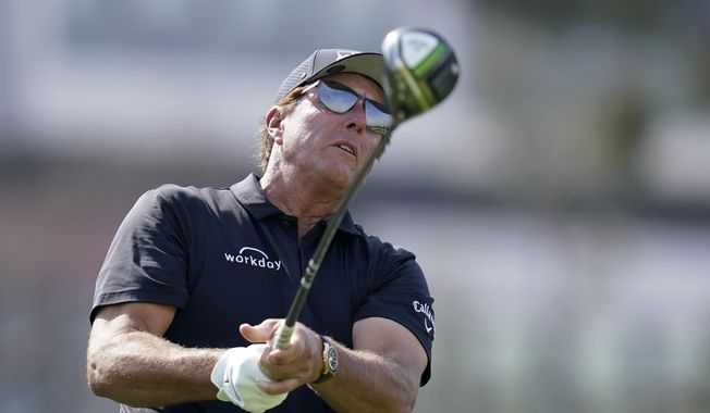 Phil Mickelson watches his tee shot on the 12th hole during a practice round of the U.S. Open Golf Championship Monday, June 14, 2021, at Torrey Pines Golf Course in San Diego. (AP Photo/Gregory Bull) **FILE**