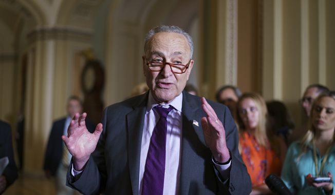 Senate Majority Leader Chuck Schumer, D-N.Y., and the Democratic leadership speak to reporters about progress on an infrastructure bill and voting rights legislation, at the Capitol in Washington, Tuesday, June 15, 2021. (AP Photo/J. Scott Applewhite) ** FiLE **