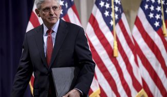 Attorney General Merrick Garland departs after speaking at the Justice Department in Washington, on Tuesday, June 15, 2021. (Win McNamee/Pool via AP)