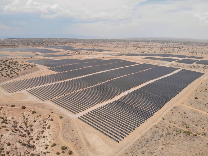 This Tuesday, June 15, 2021 image shows a solar farm west of Rio Rancho, N.M., that Public Service Co. of New Mexico uses to help power Facebook's data center in central New Mexico. The utility has received dozens of pre-applications and interconnection requests as state regulators draft new rules for community solar programs. (AP Photo/Susan Montoya Bryan)