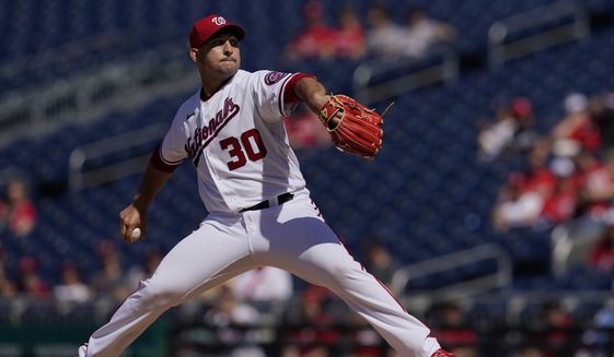 Washington Nationals relief pitcher Paolo Espino delivers a pitch during the first inning of a baseball game against the Pittsburgh Pirates, Wednesday, June 16, 2021, in Washington. (AP Photo/Carolyn Kaster)