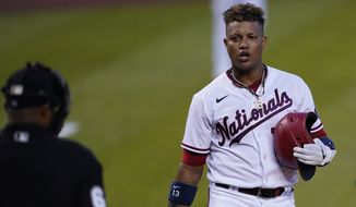 In this Monday, June 14, 2021, photo, Washington Nationals second baseman Starlin Castro (13) talks to the umpire during a baseball game, in Washington. The Washington Nationals announced Wednesday, June 16, 2021, that Castro has been placed on the Restricted List. (AP Photo/Carolyn Kaster) **FILE**