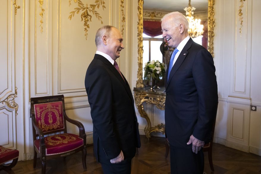 Russian president Vladimir Putin, left, talks with US president Joe Biden, right, during the US - Russia summit in Geneva, Switzerland, Wednesday, June 16, 2021. (Peter Klaunzer/Keystone via AP)
