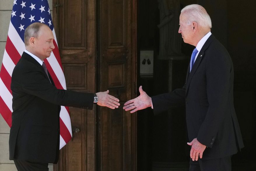 Russian President Vladimir Putin, left, and U.S President Joe Biden shake hands during their meeting at the 'Villa la Grange' in Geneva, Switzerland in Geneva, Switzerland, Wednesday, June 16, 2021. (AP Photo/Alexander Zemlianichenko, Pool)