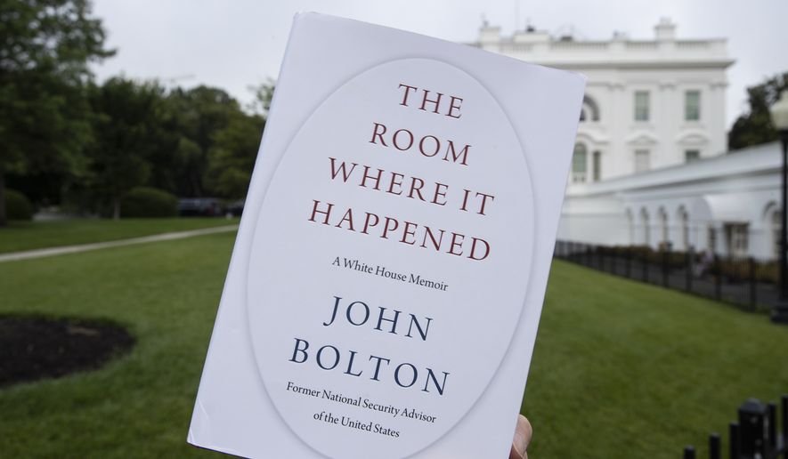 FILE - In this June 18, 2020, file photo a copy of &quot;The Room Where It Happened,&quot; by former national security adviser John Bolton, is photographed at the White House in Washington. The Justice Department has abandoned its lawsuit against former Trump administration national security adviser John Bolton over a book that officials argued disclosed classified information, and prosecutors have also dropped a grand jury investigation over the book’s publication. (AP Photo/Alex Brandon, File)