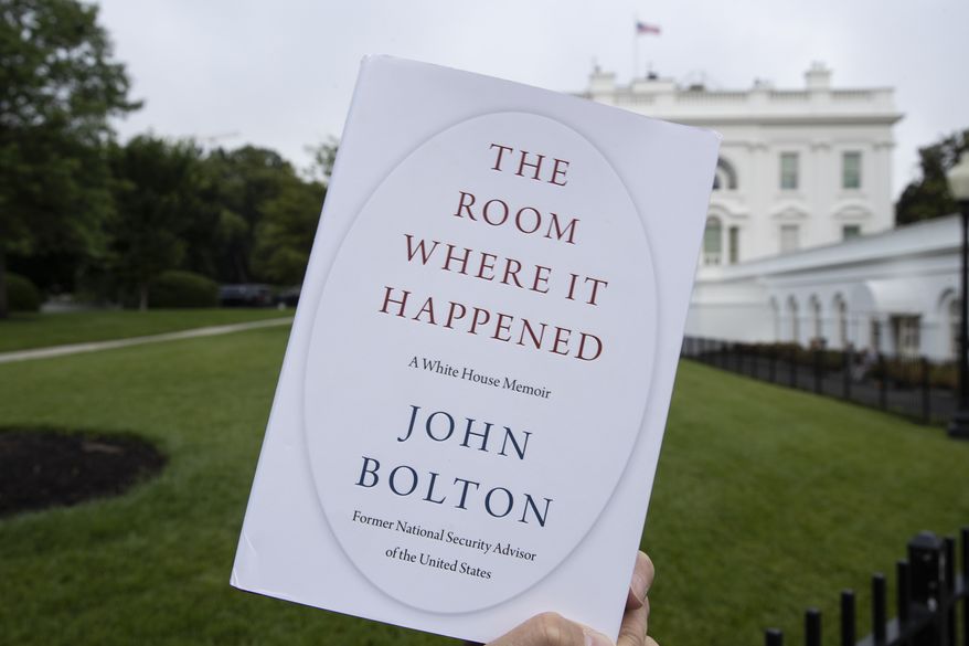 FILE - In this June 18, 2020, file photo a copy of &quot;The Room Where It Happened,&quot; by former national security adviser John Bolton, is photographed at the White House in Washington. The Justice Department has abandoned its lawsuit against former Trump administration national security adviser John Bolton over a book that officials argued disclosed classified information, and prosecutors have also dropped a grand jury investigation over the book’s publication. (AP Photo/Alex Brandon, File)