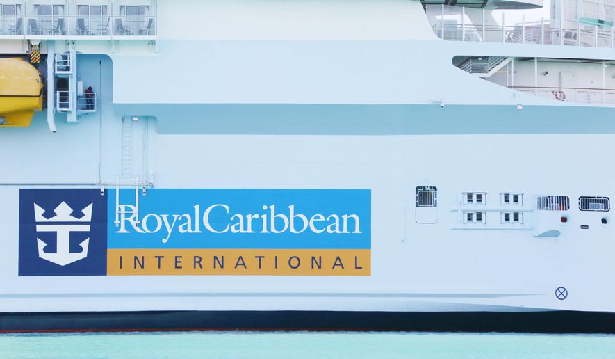 In this March 14, 2020, file photo, a Royal Caribbean International cruise ship docks at PortMiami, among other cruise ships, as the world deals with the coronavirus outbreak in Miami. (AP Photo/Brynn Anderson, File)