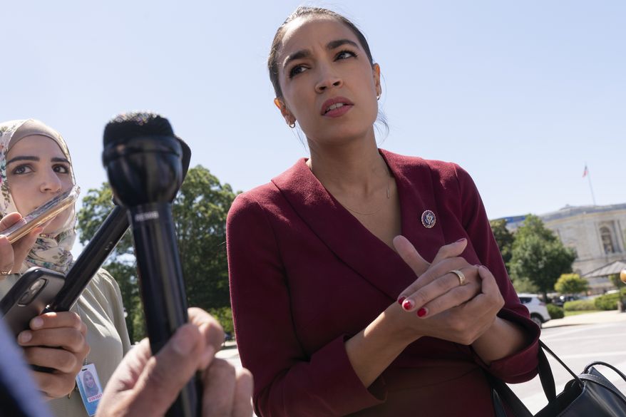 Rep. Alexandria Ocasio-Cortez, D-N.Y., speaks with reporters, Thursday, June 17, 2021, as she arrives on Capitol Hill in Washington. (AP Photo/Jacquelyn Martin) **FILE**