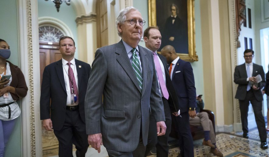 Senate Minority Leader Mitch McConnell, R-Ky., returns to the Senate chamber after a news conference to criticize the Democrat push to pass a voting rights bill, at the Capitol in Washington, Thursday, June 17, 2021. (AP Photo/J. Scott Applewhite)