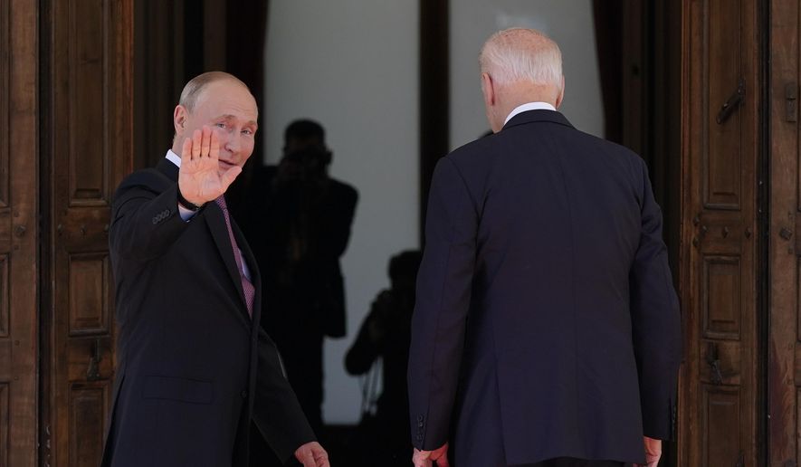 Russian President Vladimir Putin waves as he meets with President Joe Biden, Wednesday, June 16, 2021, in Geneva, Switzerland. (AP Photo/Patrick Semansky)