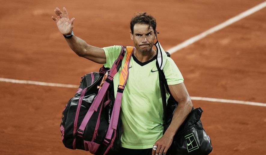 Spain&#39;s Rafael Nadal waves to the crowd after losing to Serbia&#39;s Novak Djokovic in their semifinal match of the French Open tennis tournament at the Roland Garros stadium Friday, June 11, 2021 in Paris. Djokovic won 3-6, 6-3, 7-6 (4), 6-2. (AP Photo/Thibault Camus)