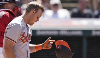 Baltimore Orioles&#39; Pat Valaika drops his helmet after striking out in the eighth inning of a baseball game against the Cleveland Indians, Thursday, June 17, 2021, in Cleveland. (AP Photo/Tony Dejak)