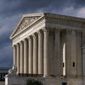 In this June 8, 2021, photo, the Supreme Court is seen in Washington. (AP Photo/J. Scott Applewhite)