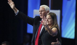 Former vice president Mike Pence and his wife Karen wave after he spoke during the Road to Majority convention at Gaylord Palms Resort &amp; Convention Center in Kissimmee, Fla., on Friday, June 18, 2021. (Stephen M. Dowell/Orlando Sentinel via AP)